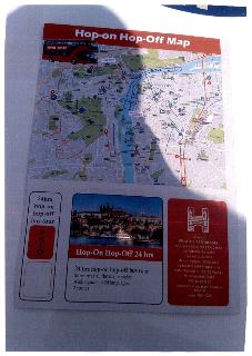 Plakát / leták: Hop-on Hop-Off Map, Prague Panorama. Obsahuje mapu Prahy s trasami vyhlídkového autobusu, nápis '24hrs hop-on hop-off bus tour', razítko PAID,…