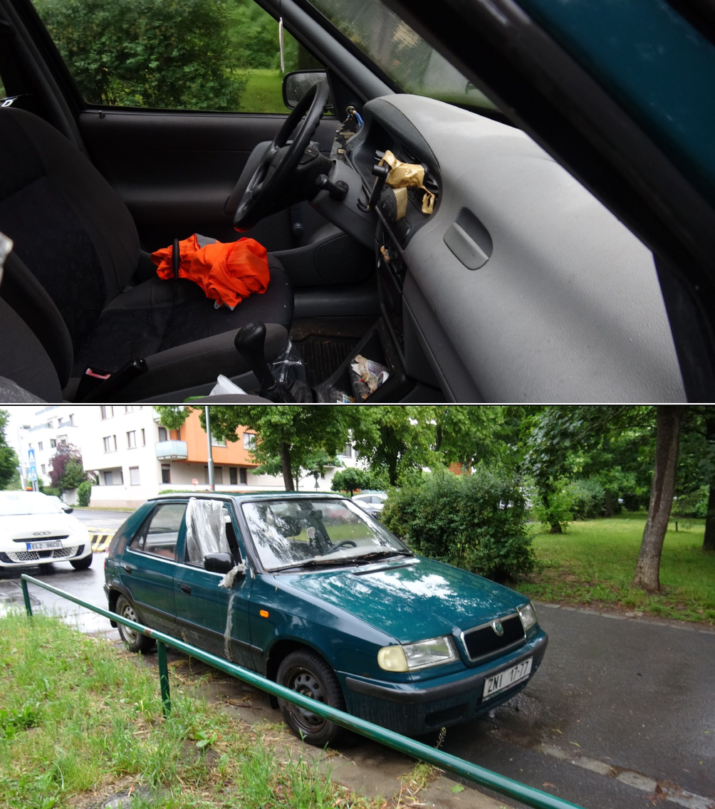 Fotografie osobního automobilu značky Škoda (pravděpodobně model Felicia) tmavě zelené barvy, registrační značka ZN1 17-77. Vozidlo má poškozené okénko u řidiče (provizorně zakryté fólií) a interiér jeví známky zanedbání.