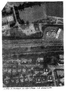 Letecký snímek (ortofoto) území s vyznačeným měřením vzdáleností na silnici. V obrázku jsou ručně psané poznámky: '570m', '65m', 'SMĚR PLZEŇ', 'SMĚR HZ, HL', '…