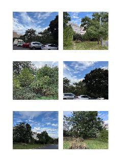 Fotografie pozemku a okolí (parkoviště, stromy, budovy v pozadí), pravděpodobně dokumentace k záměru či stavbě.