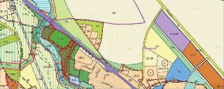 Výřez územního plánu (funkční využití ploch) pro oblast Praha-Kolovraty a Praha-Uhříněves. Mapa obsahuje barevně odlišené plochy s kódy funkčního využití, jako…