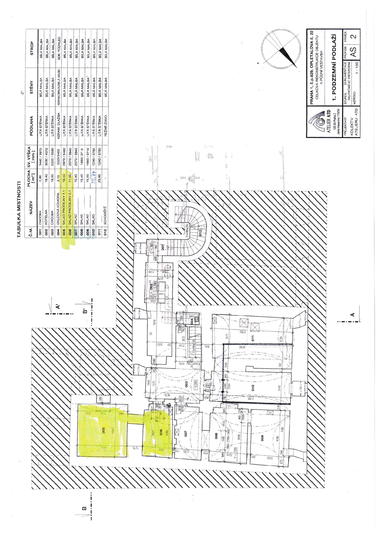 Plán podlaží (1. podzemní podlaží) s tabulkou místností pro rekonstrukci objektu v Praze.