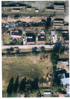 Ortofotomapa území s vyznačenými parcelními čísly. Čitelná čísla parcel: 1218/55, 1235, 1236, 1238, 1237, 1240, 1242, 1244/2, 1232/4, 1243 (označeno červeným k…