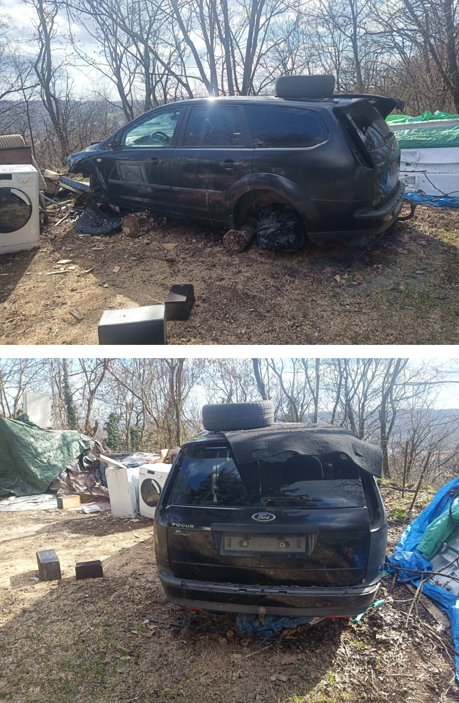 Fotografie vraku osobního automobilu značky Ford Focus (kombi) odstaveného na pozemku. Na zadních dveřích kufru je čitelný nápis 'FOCUS' a logo 'Ford'.