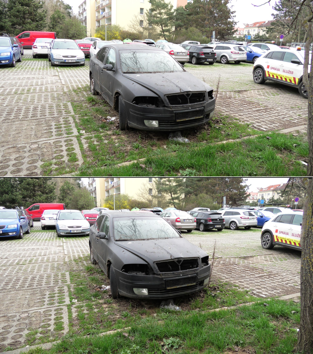 Fotografie opuštěného, nepojízdného osobního automobilu značky Škoda (pravděpodobně model Octavia) na parkovišti. Na boku bílého vozidla v pravé části snímku je nápis: 'SPRÁVA SLUŽEB HLAVNÍHO MĚSTA PRAHY'.