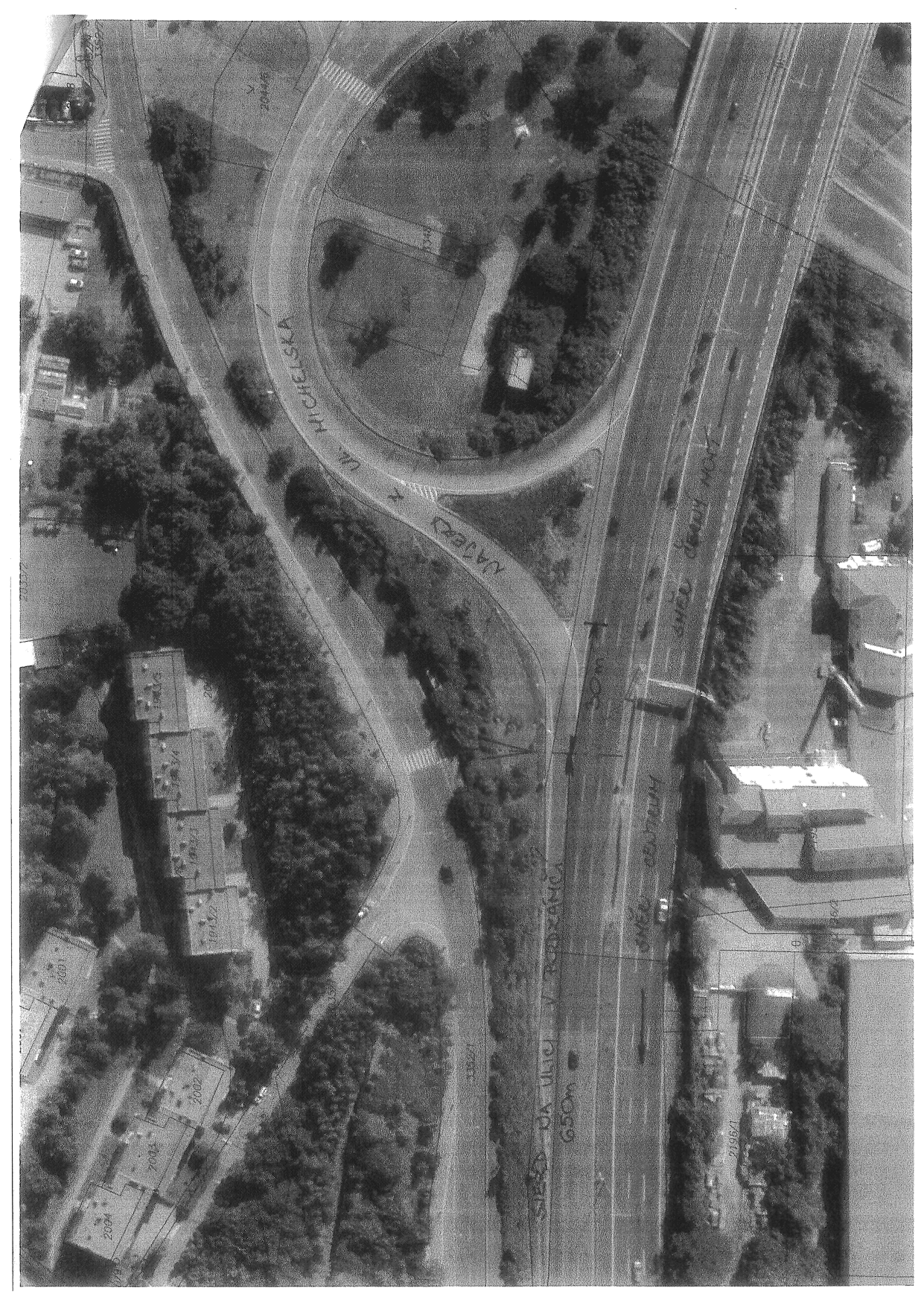 Situační nákres (ortofotomapa) dopravního uzlu s vyznačenými informacemi: 'NAJEZD NA UL. MICHELSKA', 'SMĚR JIŽNÍ MOST', 'SMĚR CENTRUM', 'SJEZD NA ULICI V PODZÁMČÍ 650m', '30m'. V mapě jsou patrná čísla parcel (např. 2044/6, 2004, 2002, 2003, 2001, 2196/1).