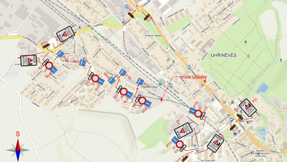 Situační nákres dopravního značení a uzavírky ulice Františka Diviše v Uhříněvsi. Mapa zobrazuje trasu uzavírky (označeno jako 'místo uzávěry') a rozmístění dopravních značek: IP22 (upozornění na uzavírku), IS11c (objížďka), B1 (zákaz vjezdu všech vozidel), IP10a/b (slepá ulice) a dodatkové tabulky E3a (vzdálenost). Zobrazené ulice: Františka Diviše, Podleská, Přátelství, Nad Volyňkou, Jezerská, Vlářská, Bystřičná, Sušilova, Ke Kříži, Břetislavova, Lidického, Vachkova, Dunajská, Na Blanici, K Podchodu, Kozákovská, Bečovská, U Uhříněveské obory.