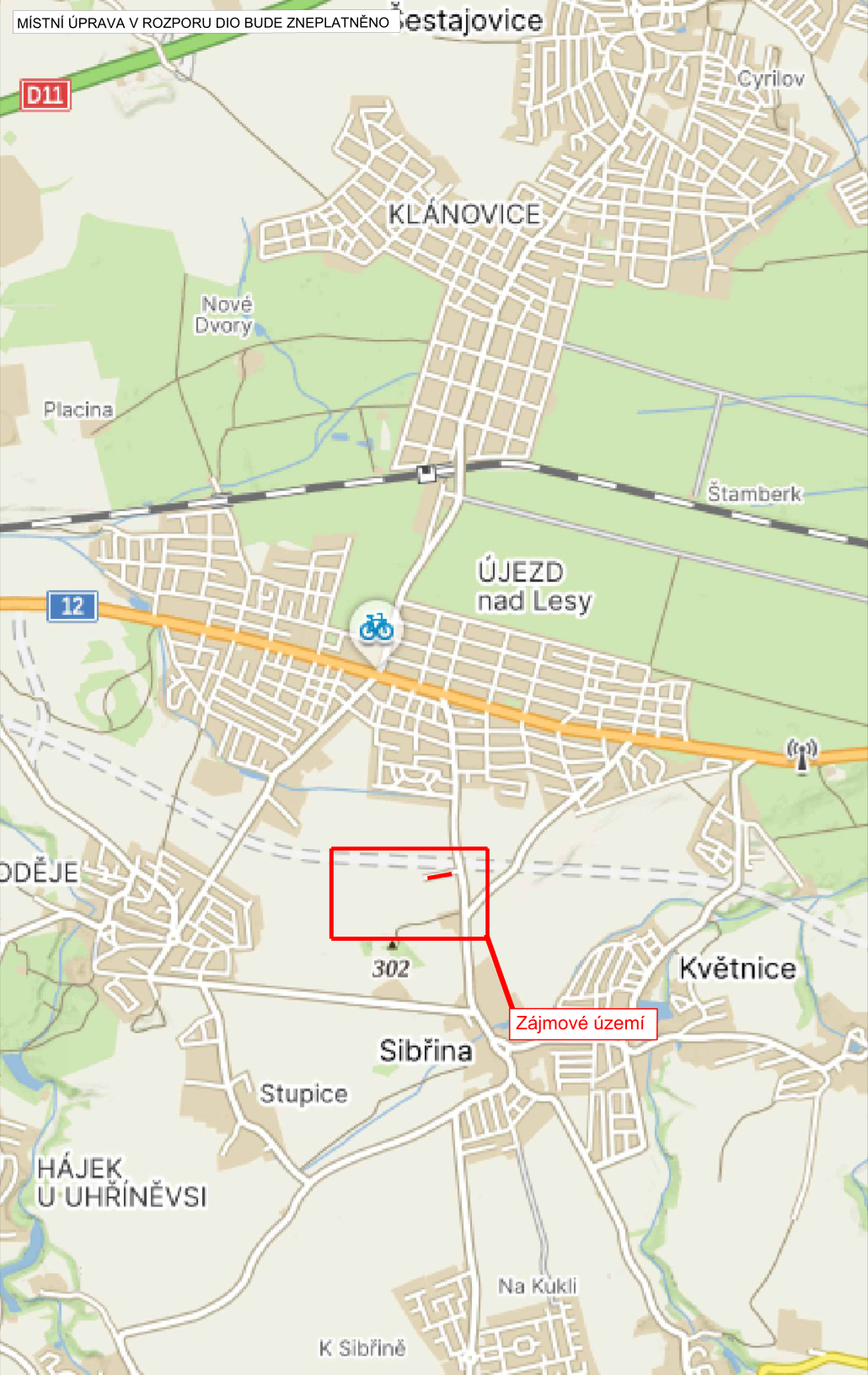 Mapa oblasti mezi obcemi Újezd nad Lesy, Sibřina a Květnice. V horní části je text: 'MÍSTNÍ ÚPRAVA V ROZPORU DIO BUDE ZNEPLATNĚNO'. V mapě je červeným rámečkem a čarou vyznačeno 'Zájmové území' nacházející se mezi obcemi Sibřina a Újezd nad Lesy. V mapě jsou dále uvedeny názvy lokalit: Šestajovice, Cyrilov, Klánovice, Nové Dvory, Placina, Újezd nad Lesy, Sibřina, Stupice, Květnice, Hájek u Uhříněvsi, Na Kukli, K Sibřině a kóta 302.