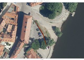 Katastrální situační nákres v k.ú. Malá Strana (měřítko 1:500). Mapa zobrazuje ortofotomapu oblasti s vyznačenými parcelními čísly: 714, 723/5, 723/8, 1040, 10…