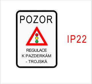 Informační dopravní značka (označení IP22) upozorňující na světelnou signalizaci v lokalitě 'K Pazderkám - Trojská'. Text na značce: 'POZOR', symbol semaforu,…